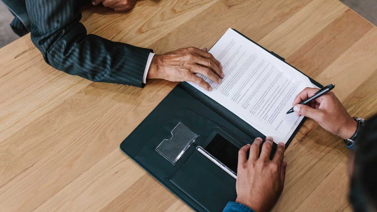 Man signing a contract
